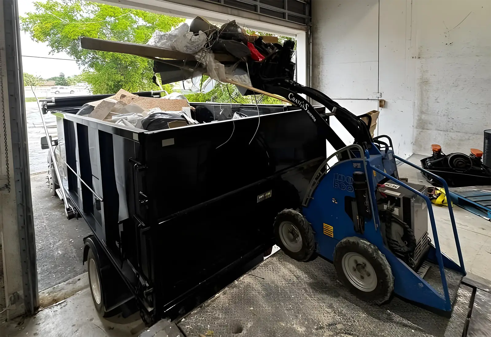 Dump Troopers crew removing construction debris from a Miami job site